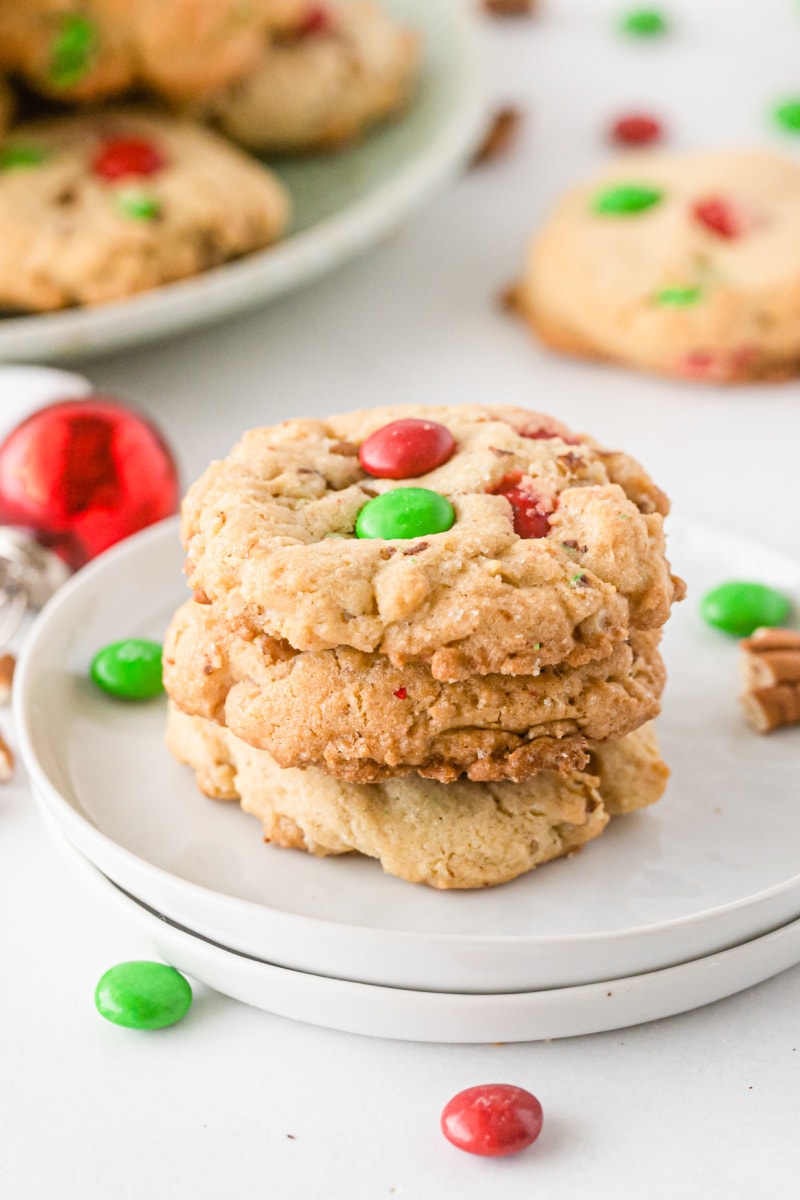 three M&M cookies stacked on plate