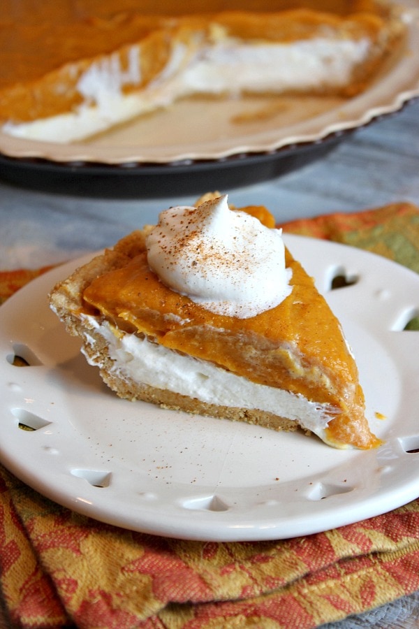 Slice of No Bake Double Layer Pumpkin Pie on a white plate