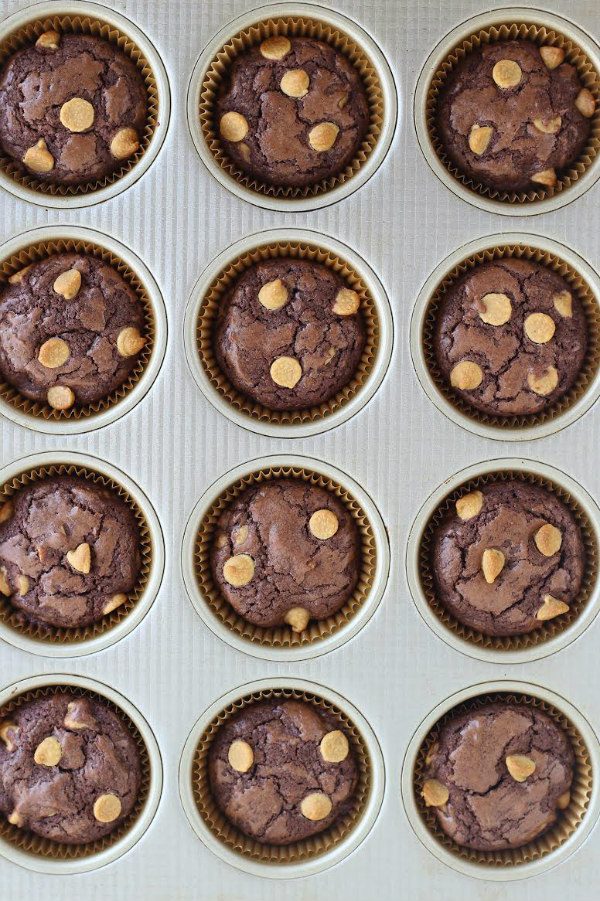 peanut butter chip brownie cupcakes in a muffin pan