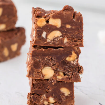 three pieces of peanut butter chocolate fudge stacked
