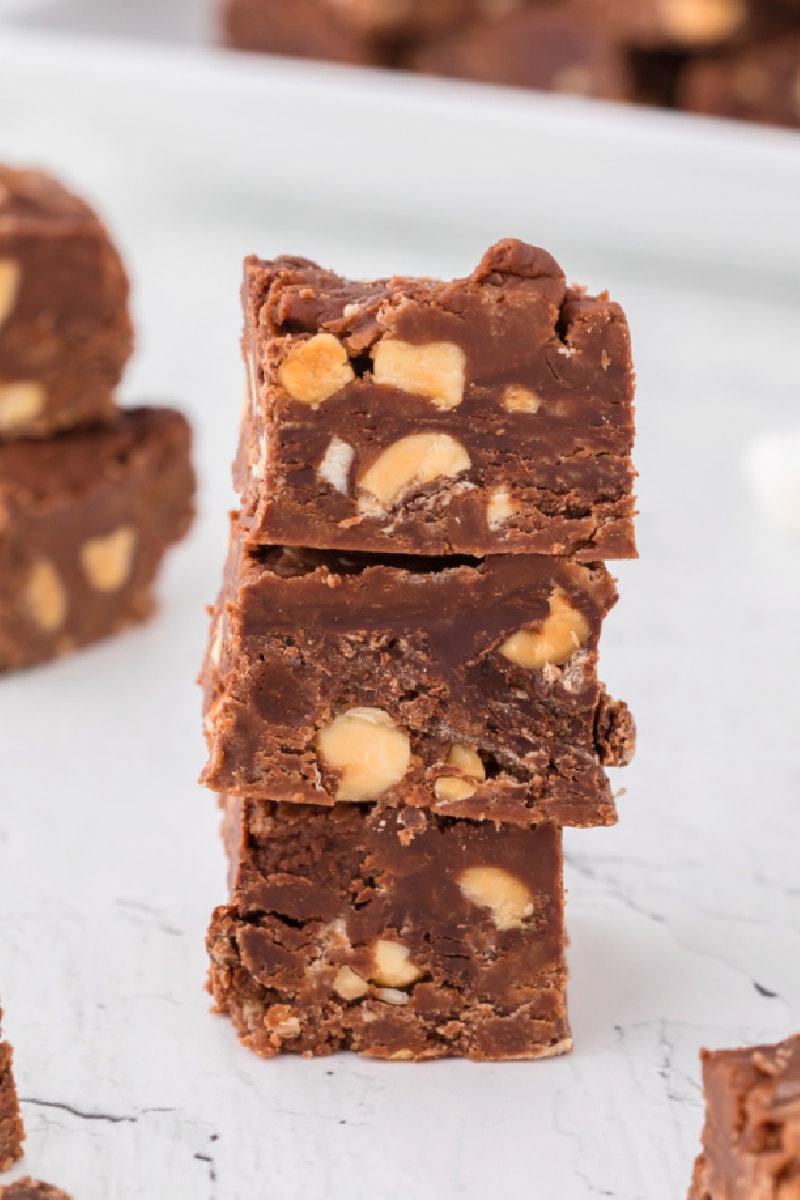 three pieces of peanut butter chocolate fudge stacked