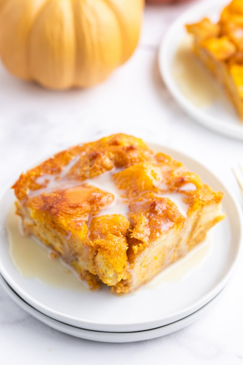 slice of pumpkin bread pudding with bourbon cream sauce