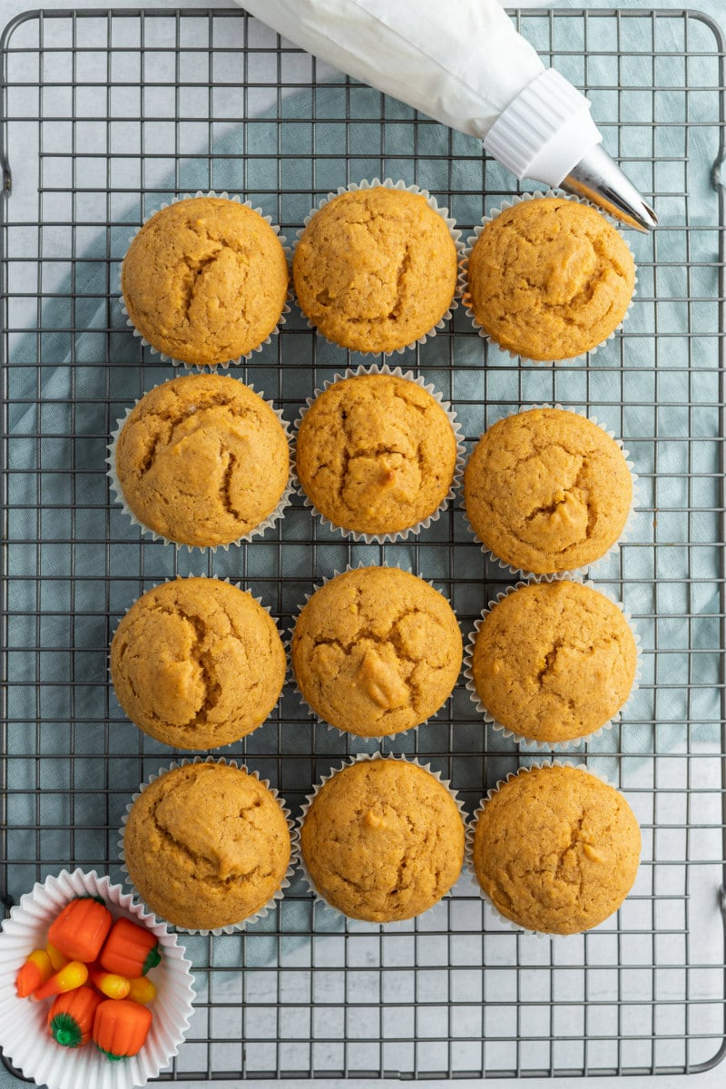 pumpkin cupcakes cooling on rack