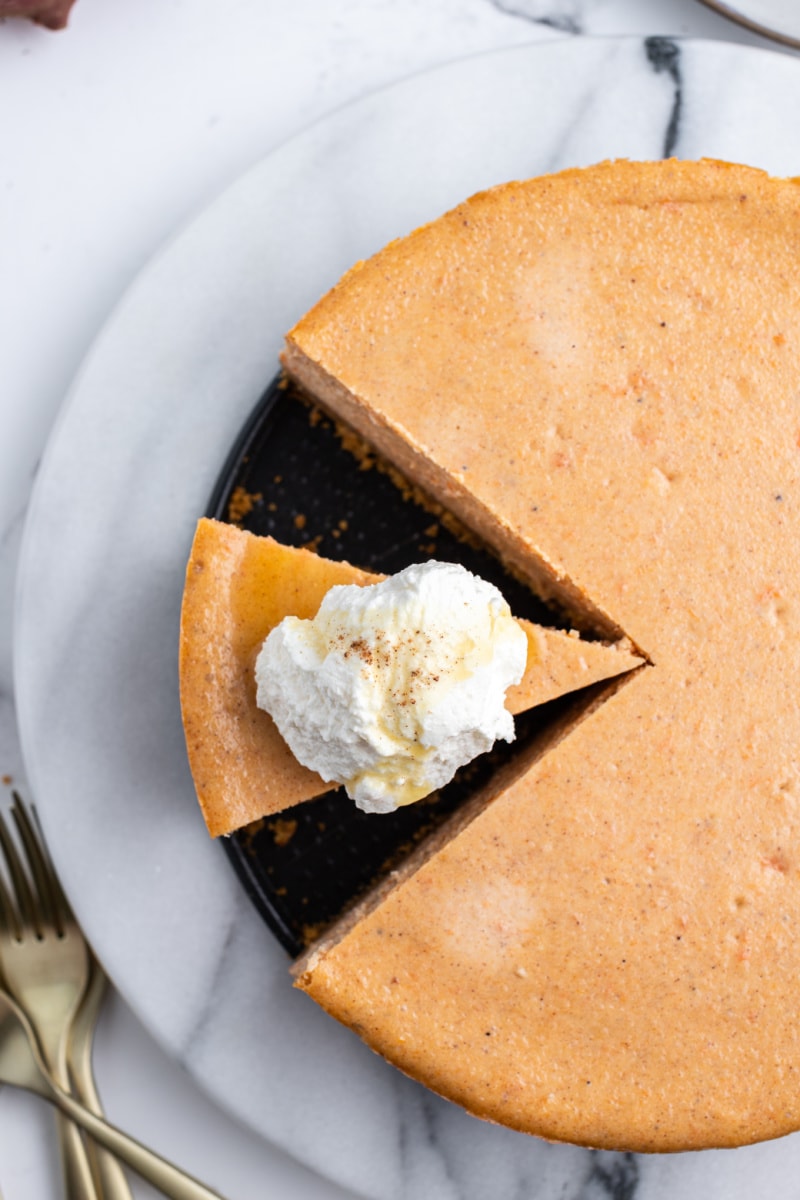 overhead shot of sweet potato cheesecake with slices removed