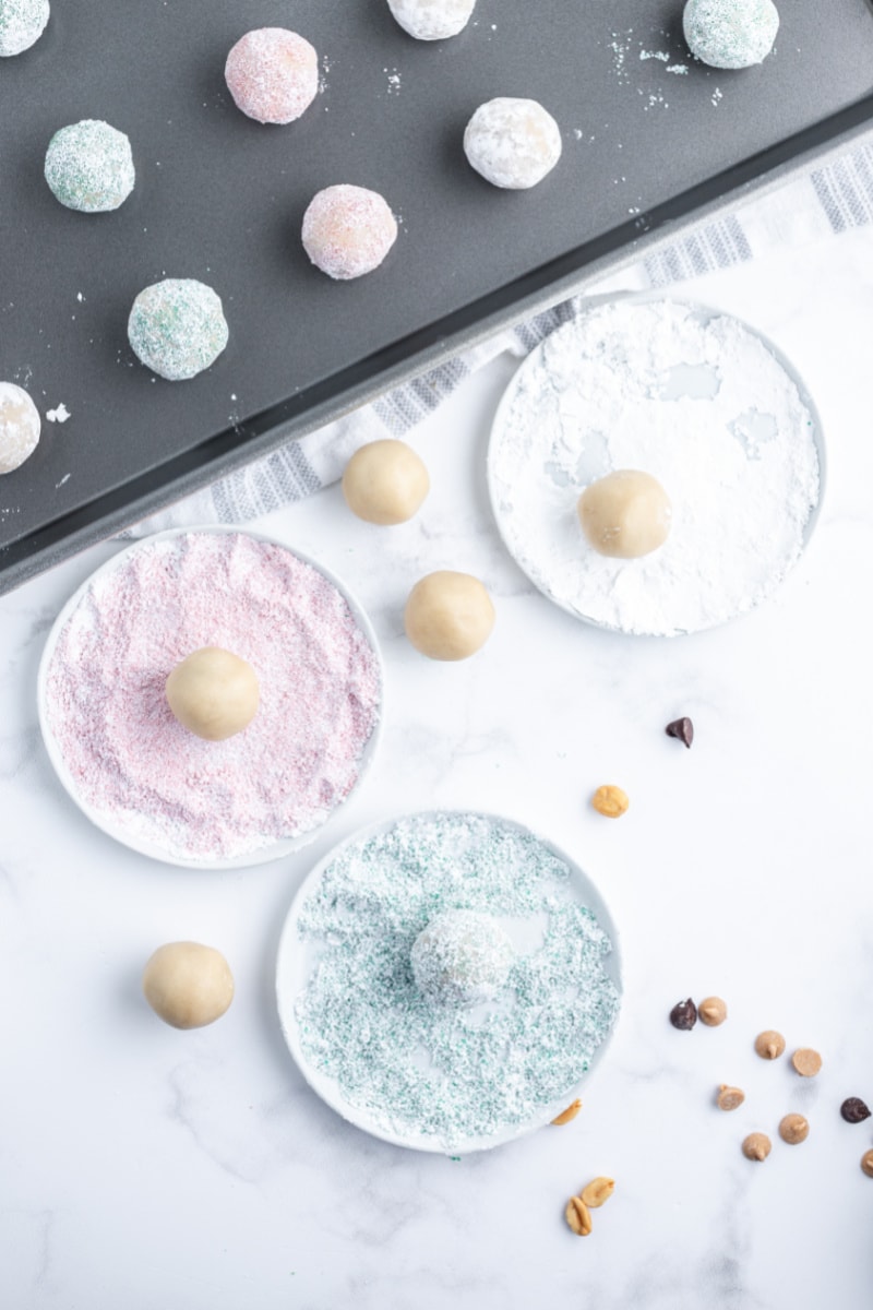 showing making snowball cookies rolling in colored sugar