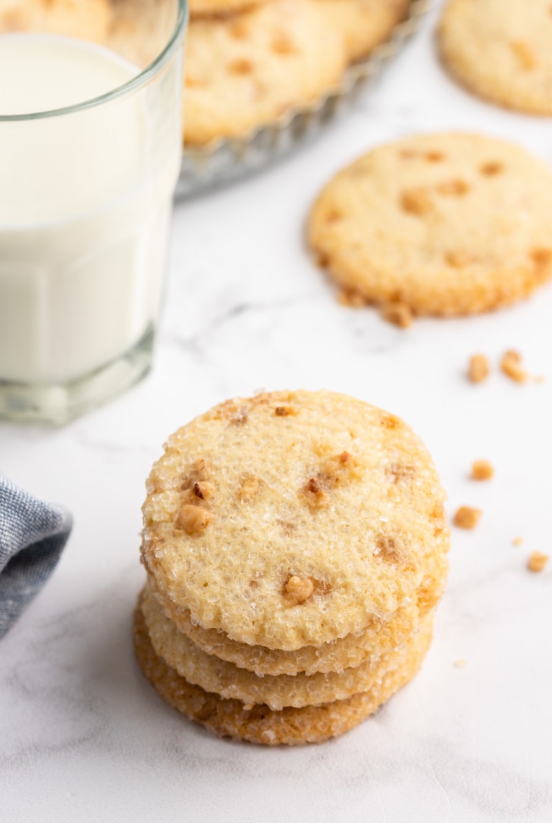 stack of cookies with glass of milk