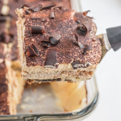 spatula taking slice of tiramisu out of pan