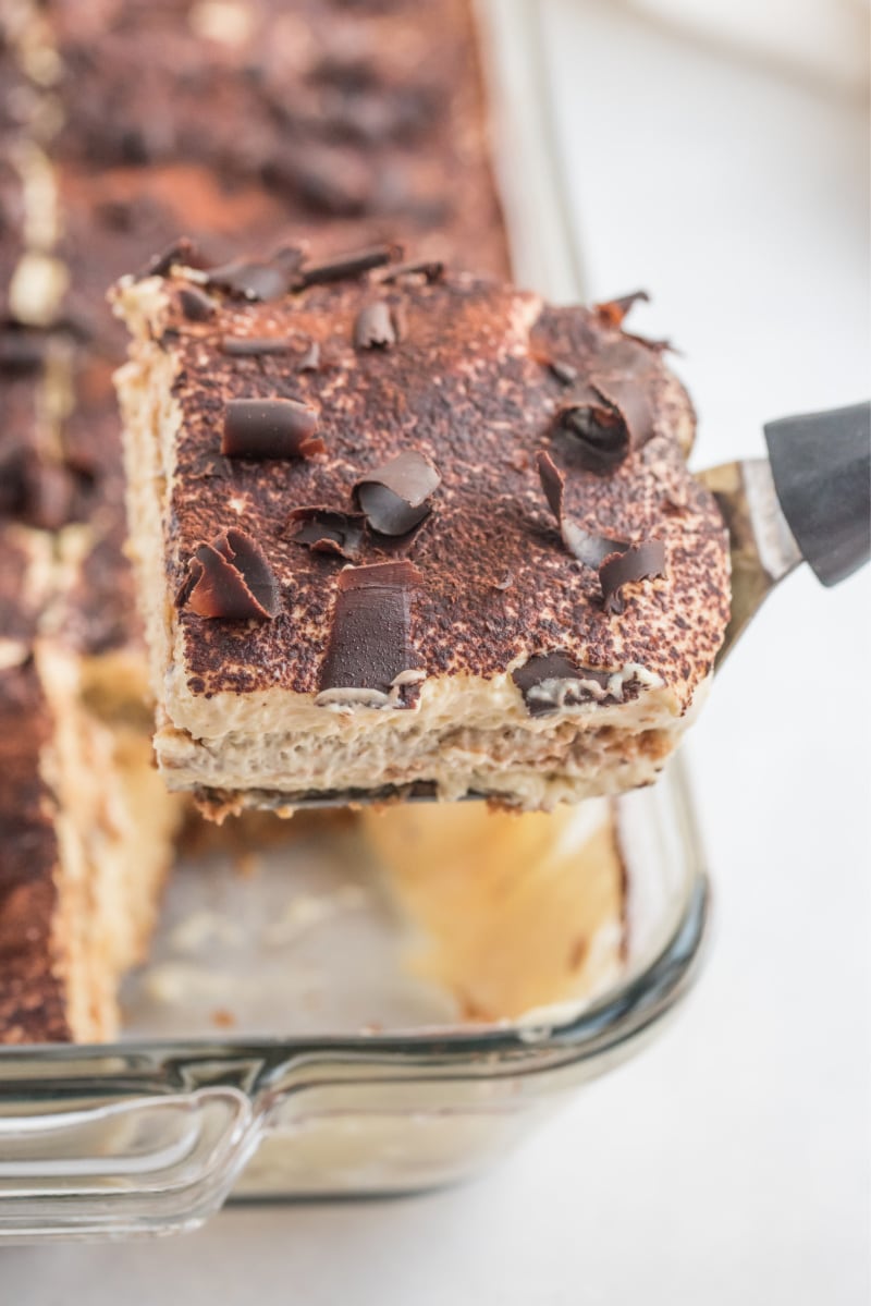 spatula taking slice of tiramisu out of pan