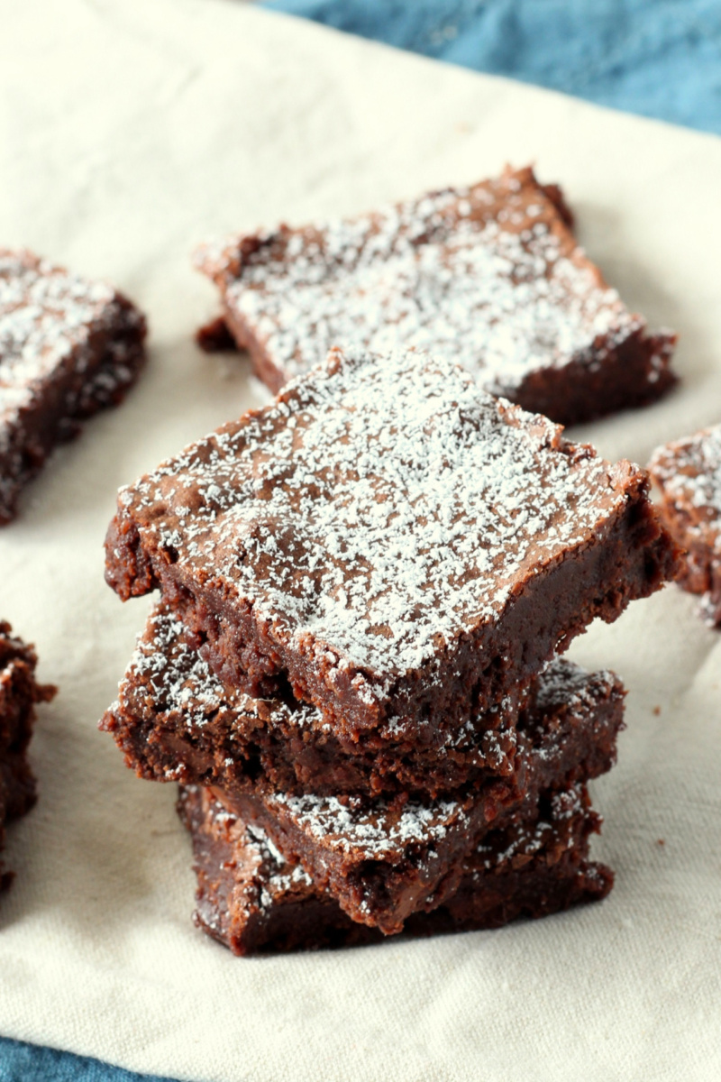 several triple chocolate brownies in a stack