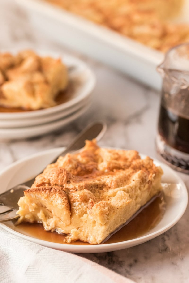 slice of maple custard bread pudding on white plate