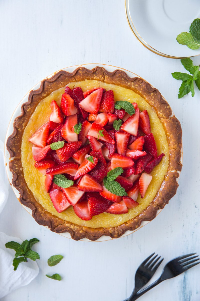 Overhead shot of Strawberry Lemon Buttermilk Pie garnished with fresh mint