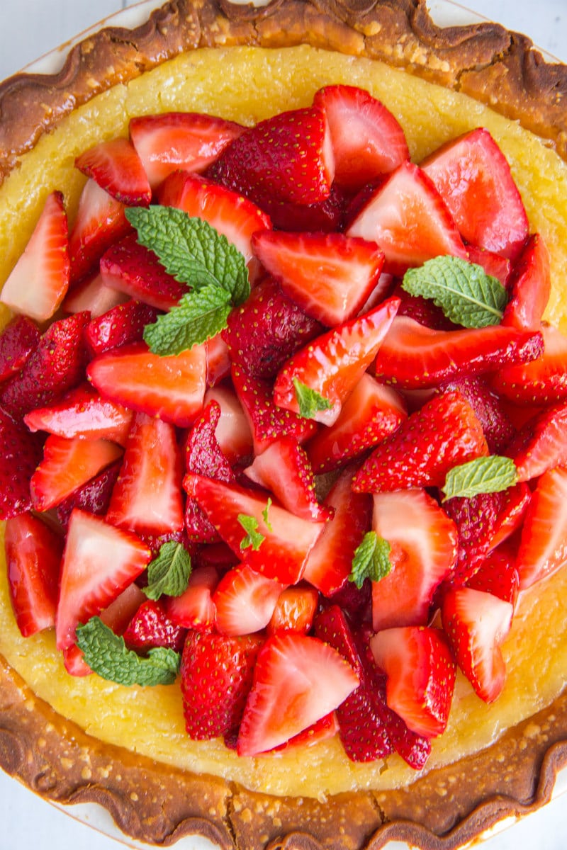 Overhead shot of Strawberry Lemon Buttermilk Pie garnished with fresh mint