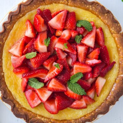 Overhead shot of Strawberry Lemon Buttermilk Pie garnished with fresh mint