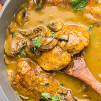 pan of amaretto chicken with spoon