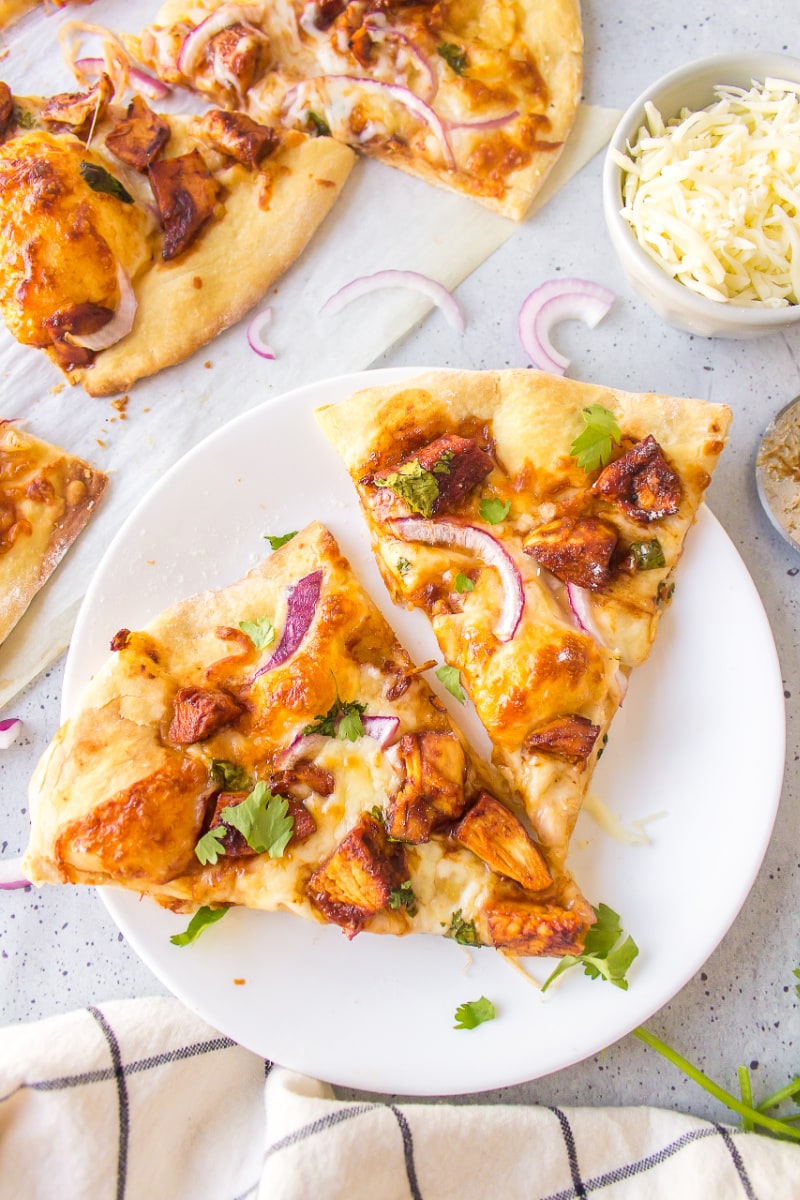 two slices of barbecue chicken pizza on a plate