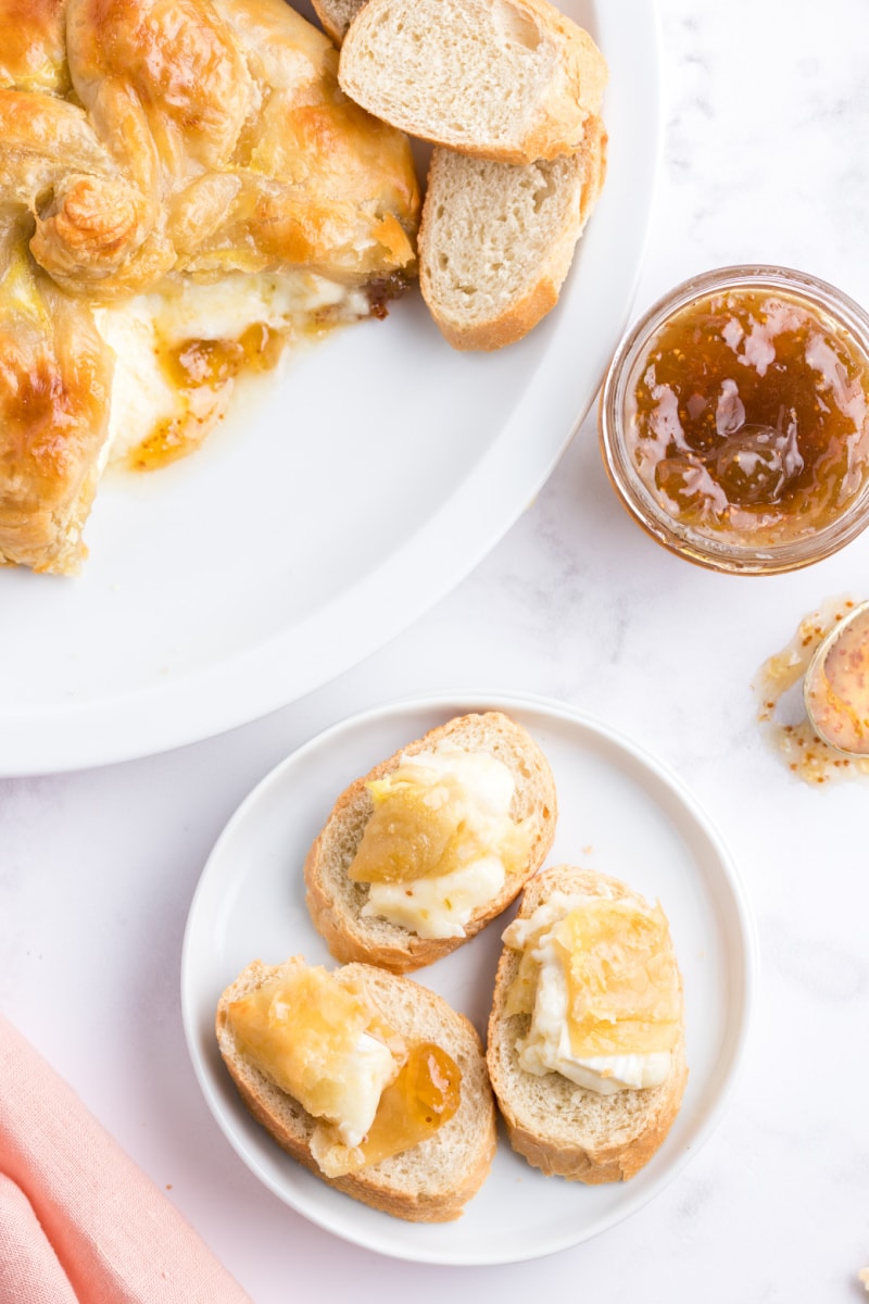 baked brie spread onto baguette slices