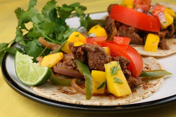 Beef Fajitas topped with Mango Salsa