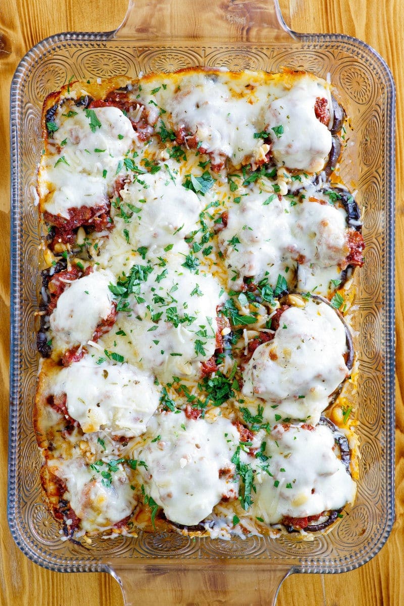 Beef and Eggplant Casserole Recipe - This Beef and Eggplant Casserole is tomato based and has plenty of added cheese. Cinnamon and pine nuts are added in to create some unique flavors. #beef #eggplant #casserole #maindish #dinnerrecipe