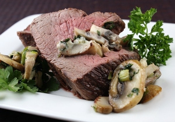 Blue Cheese and Mushroom Stuffed Beef Tenderloin Blue Cheese and Mushroom Stuffed Beef Tenderloin sliced and plated