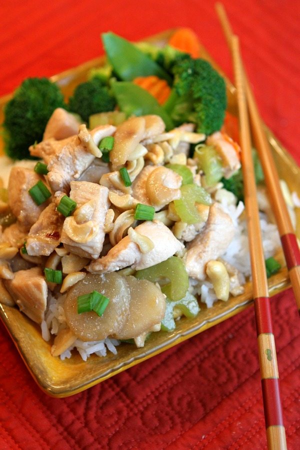 Cashew Chicken recipe from RecipeGirl.com Cashew Chicken in bowl with chopsticks