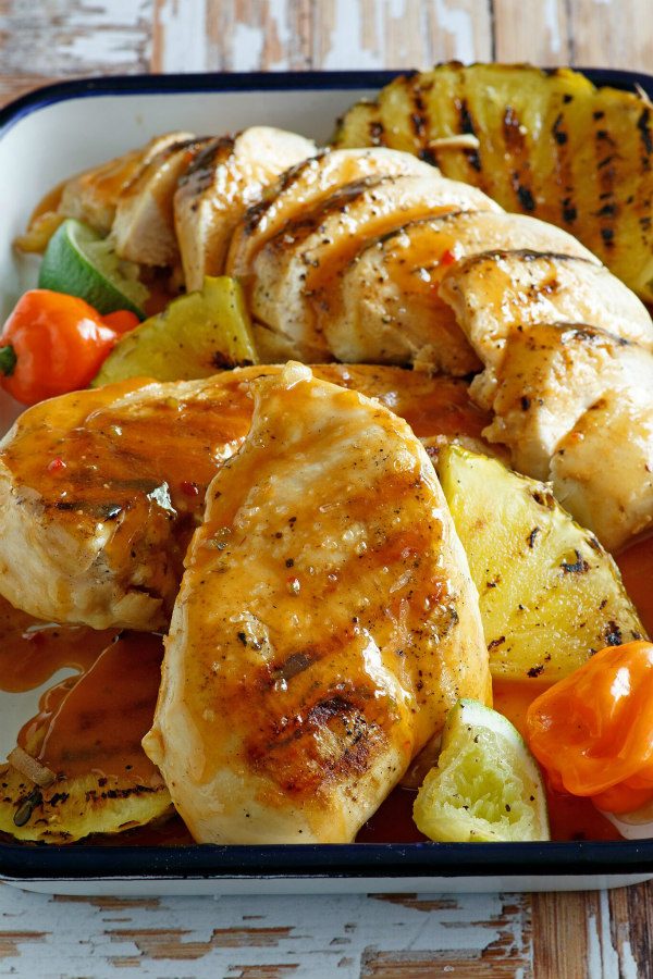 Chicken Breasts with Pineapple Tequila Marinade recipe from RecipeGirl.com #chicken #pineapple #tequila #marinade #recipe #RecipeGirl Chicken in a roasting pan with pineapple tequila marinade