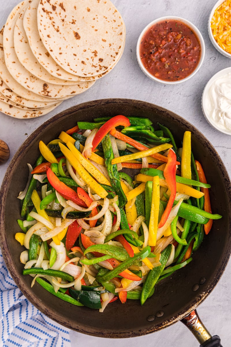 bell pepper strips cooking in skillet