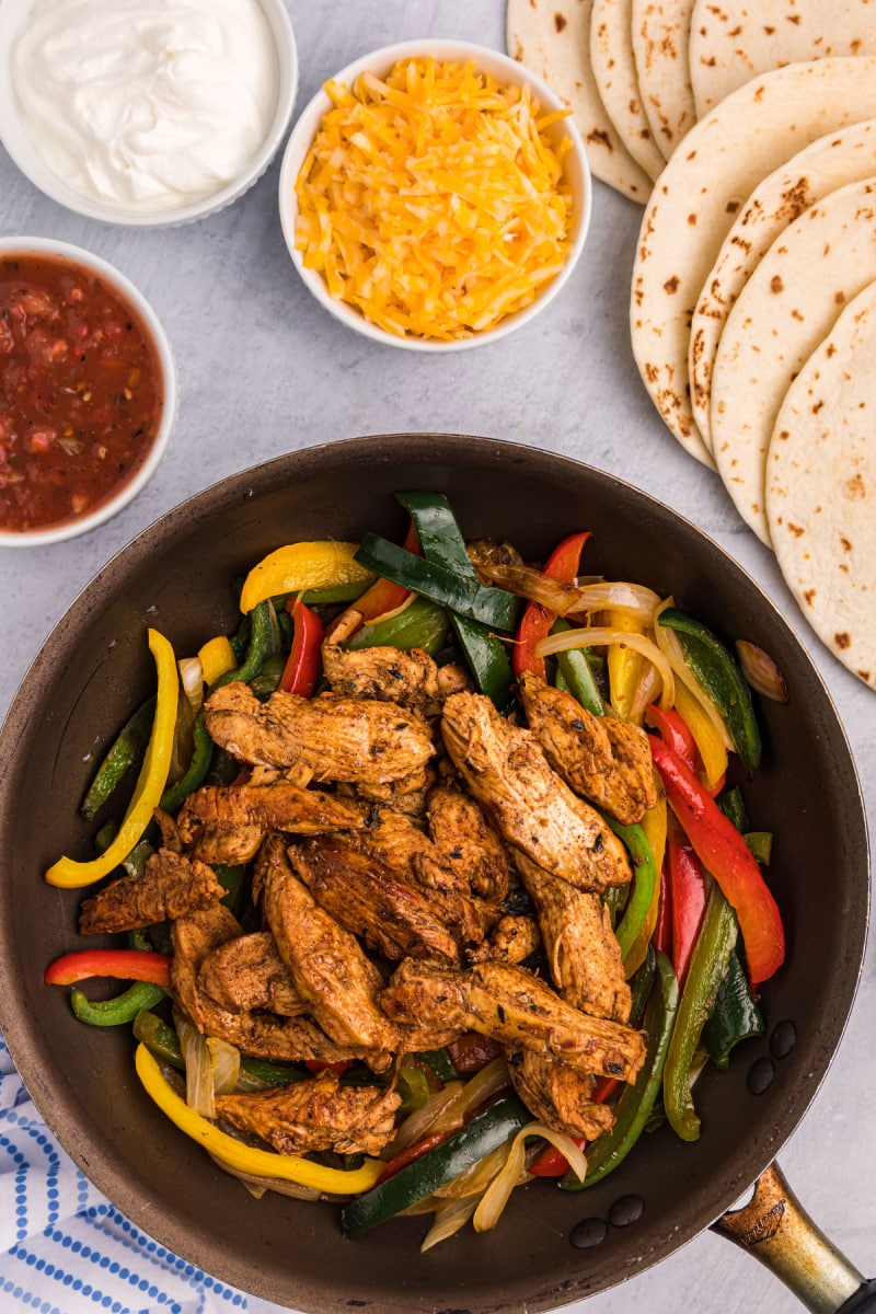 skillet with peppers and chicken strips