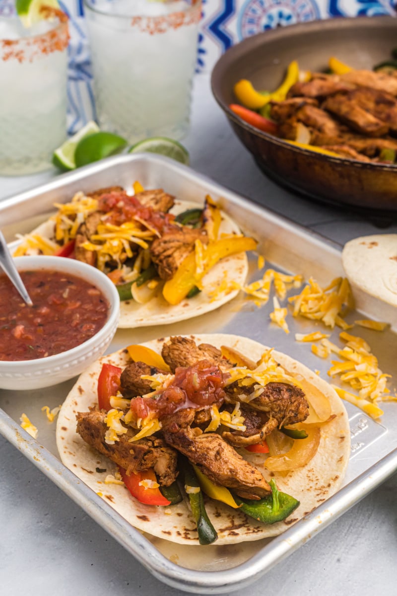 platter with tortillas and chicken fajitas