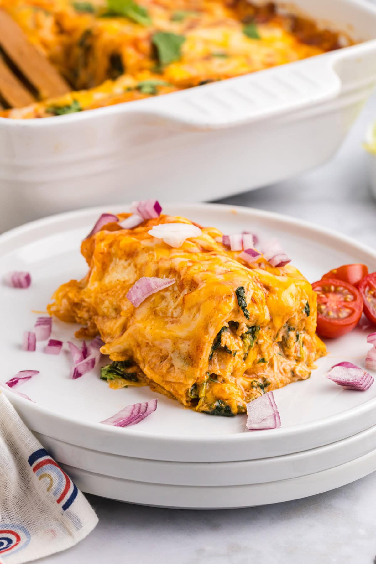 chicken and spinach enchilada on a plate