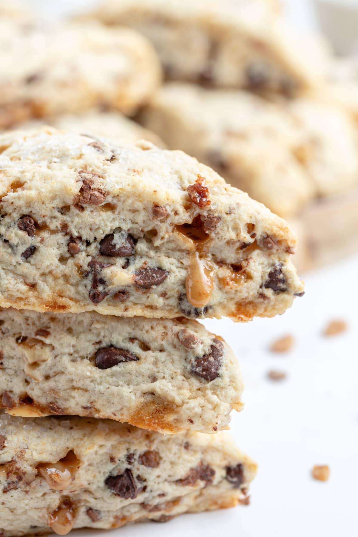 Chocolate Chip Toffee Scones recipe from RecipeGirl.com close up of two stacked chocolate chip toffee scones