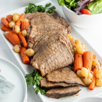 cranberry roast beef on a platter with vegetables
