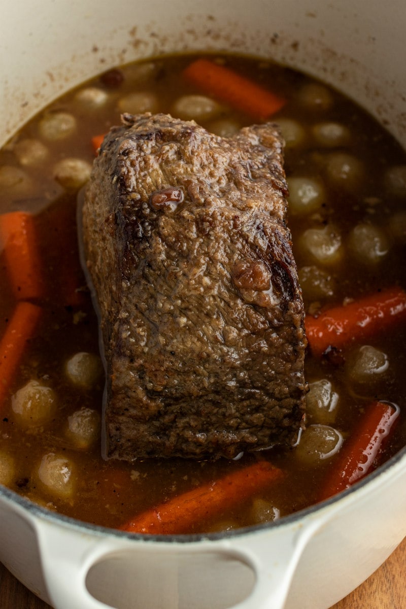 cranberry roast beef in pot with carrots and onions