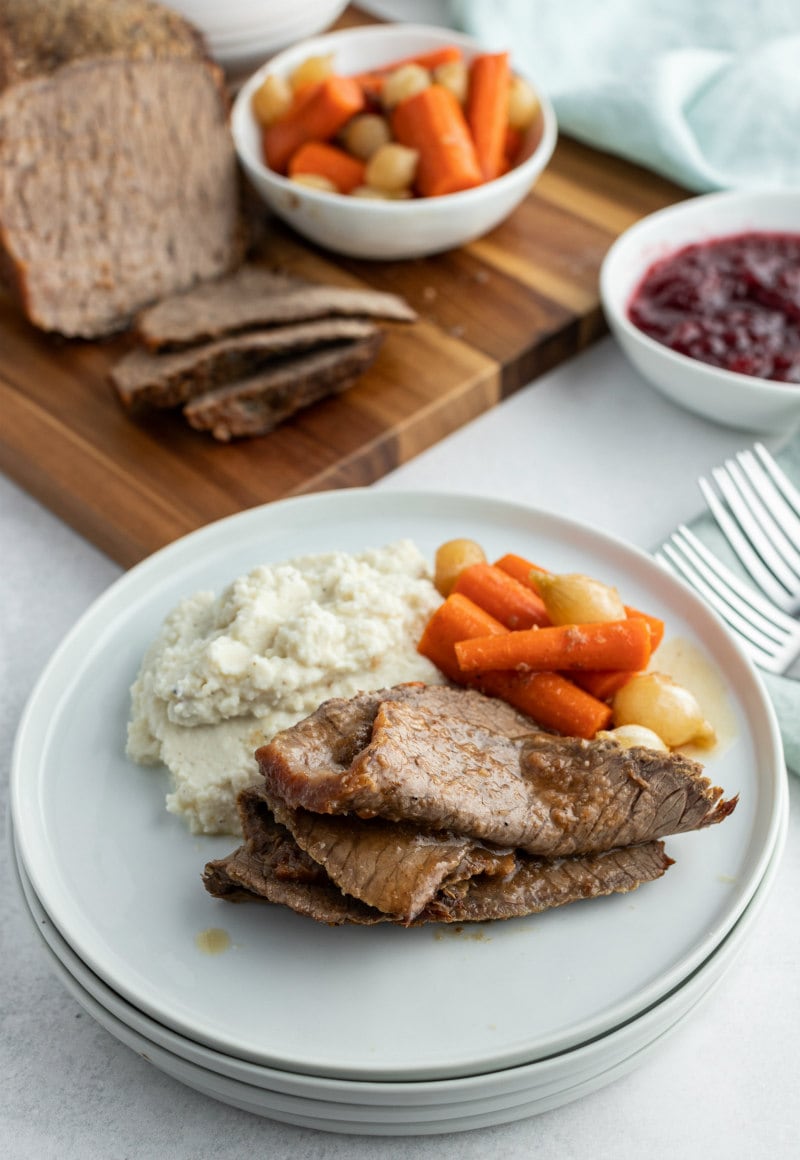 plated roast beef slices with carrots