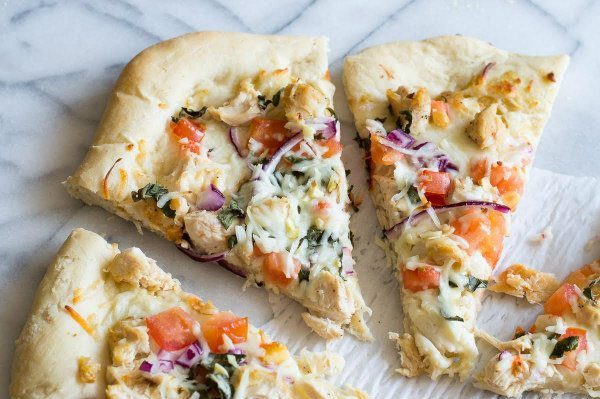 Garlic Chicken Dijon Pizza recipe from RecipeGirl.com #pizza #chicken #dijon #RecipeGirl Garlic Chicken Dijon Pizza cut into slices