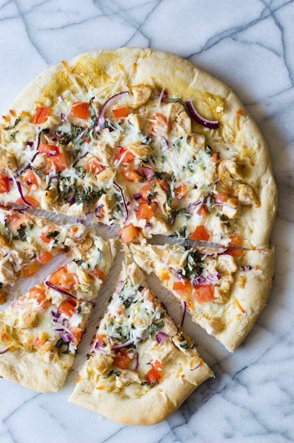Garlic Chicken Dijon Pizza recipe from RecipeGirl.com #pizza #chicken #dijon #RecipeGirl Garlic Chicken Dijon Pizza cut into slices