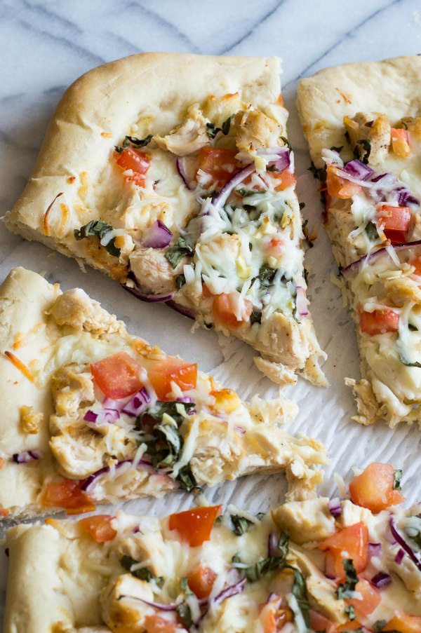 Garlic Chicken Dijon Pizza recipe from RecipeGirl.com #pizza #chicken #dijon #RecipeGirl Garlic Chicken Dijon Pizza cut into slices
