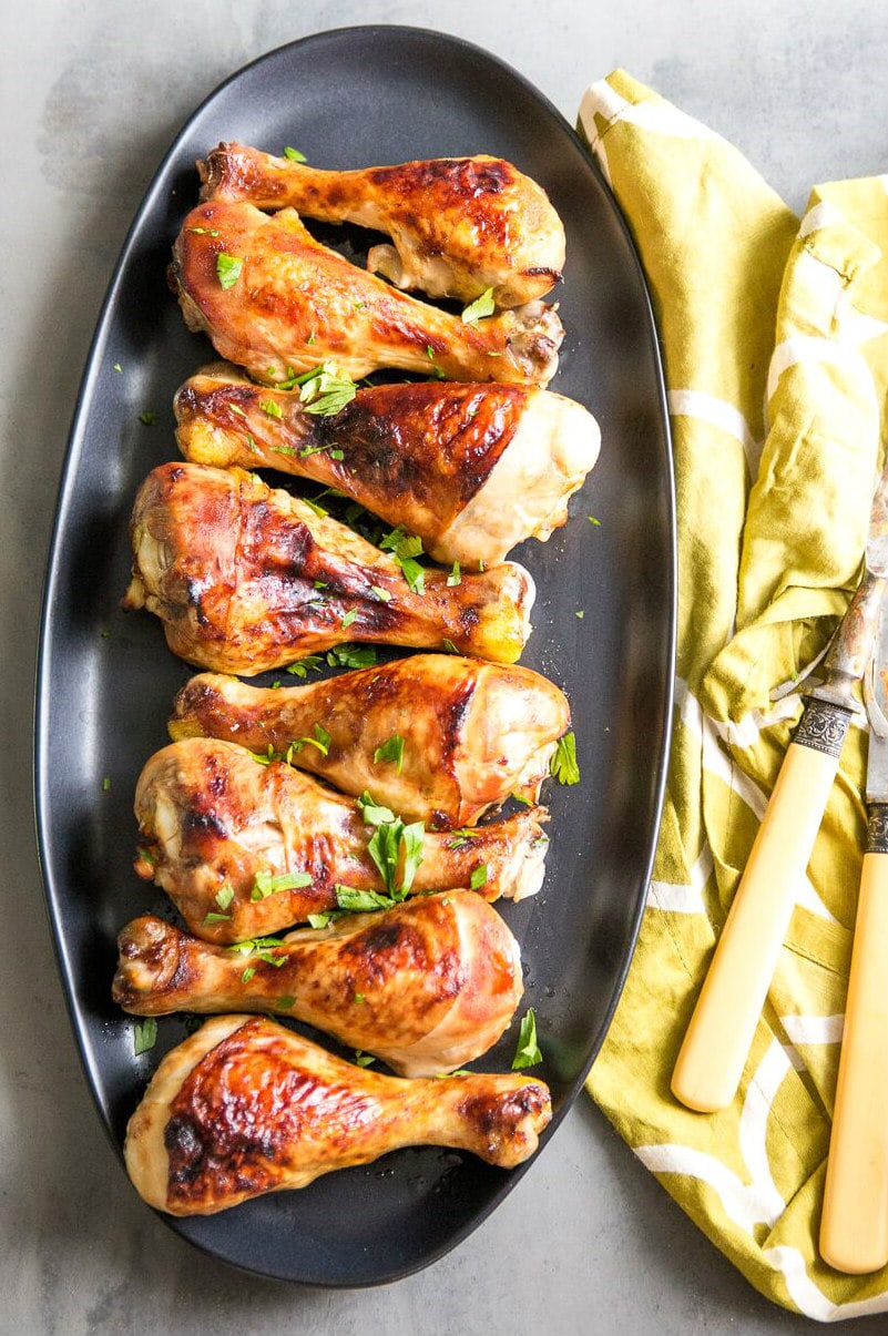 Easy Glazed Chicken Drumsticks recipe from RecipeGirl.com #easy #glazed #baked #chicken #drumsticks #recipe #RecipeGirl Glazed Chicken Drumsticks on platter