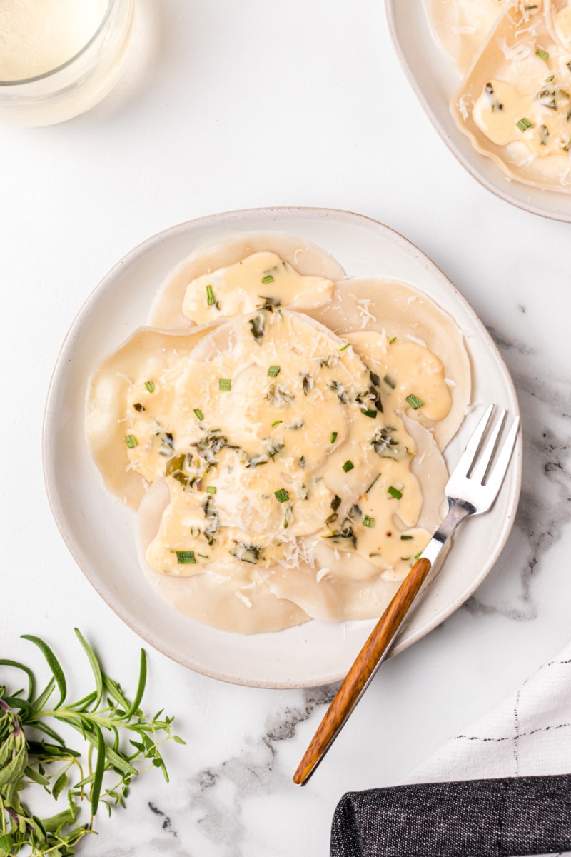 goat cheese ravioli on a plate with a fork