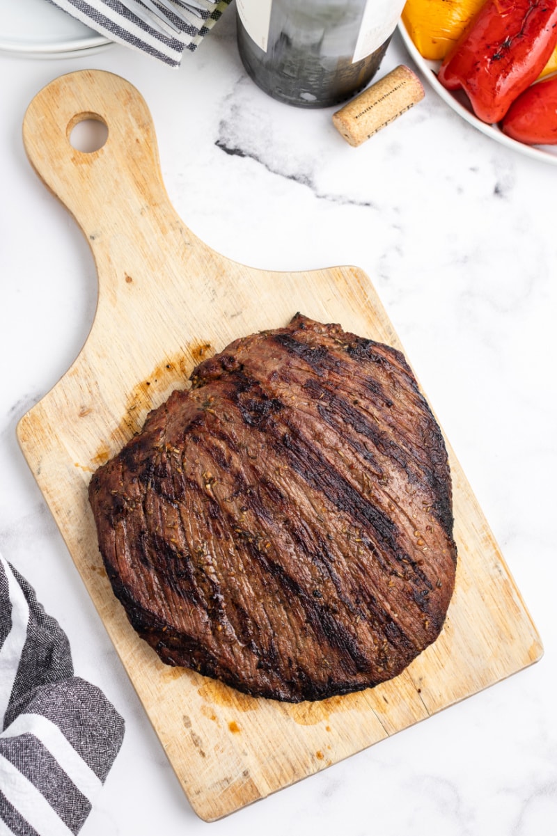 grilled flank steak on cutting board
