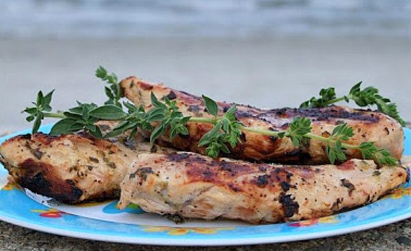 Grilled Chicken with Lemon and Oregano recipe from RecipeGirl.com #grilled #chicken #lemon #oregano #recipe #RecipeGirl Grilled Chicken with Lemon and Oregano on a blue plate with fresh oregano