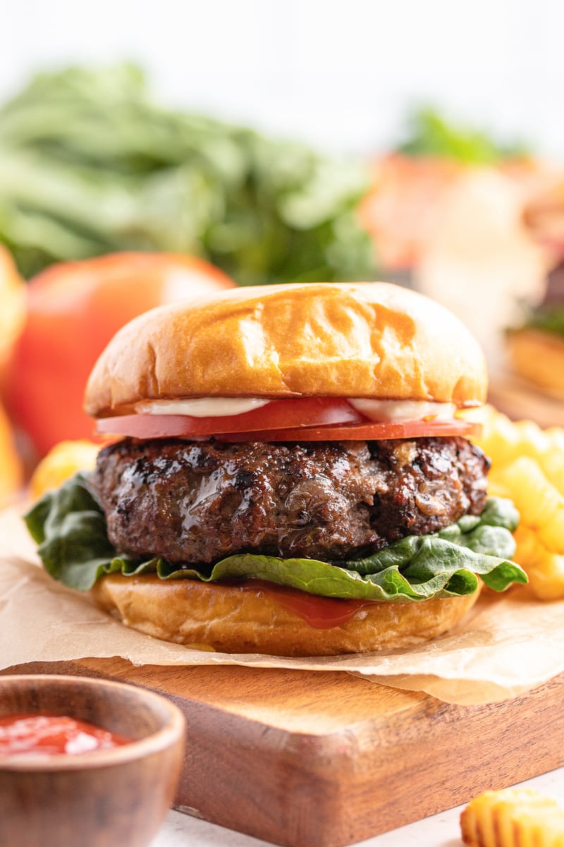 Hamburgers with Cabernet and Sauteed Onions #hamburgers #burgers #cabernet #sauteedonions #recipe #RecipeGirl hamburger on a cutting board