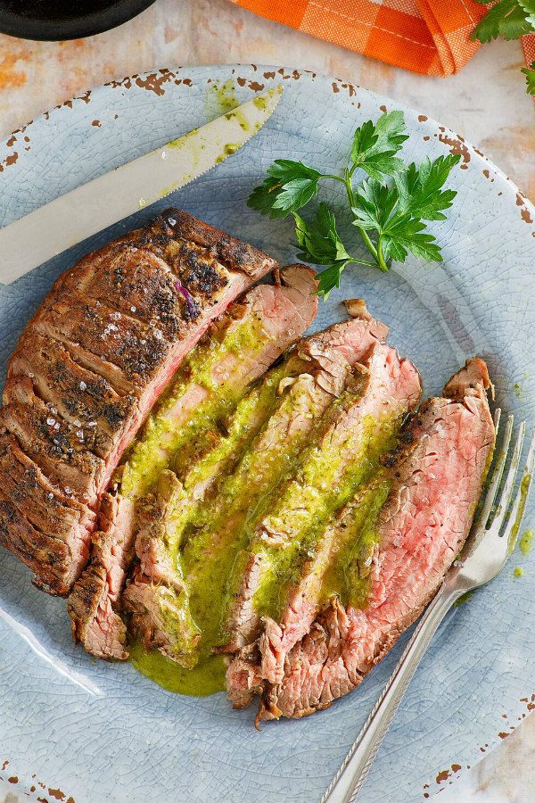 Marinated Flank Steak with Cilantro Parsley Vinaigrette sliced