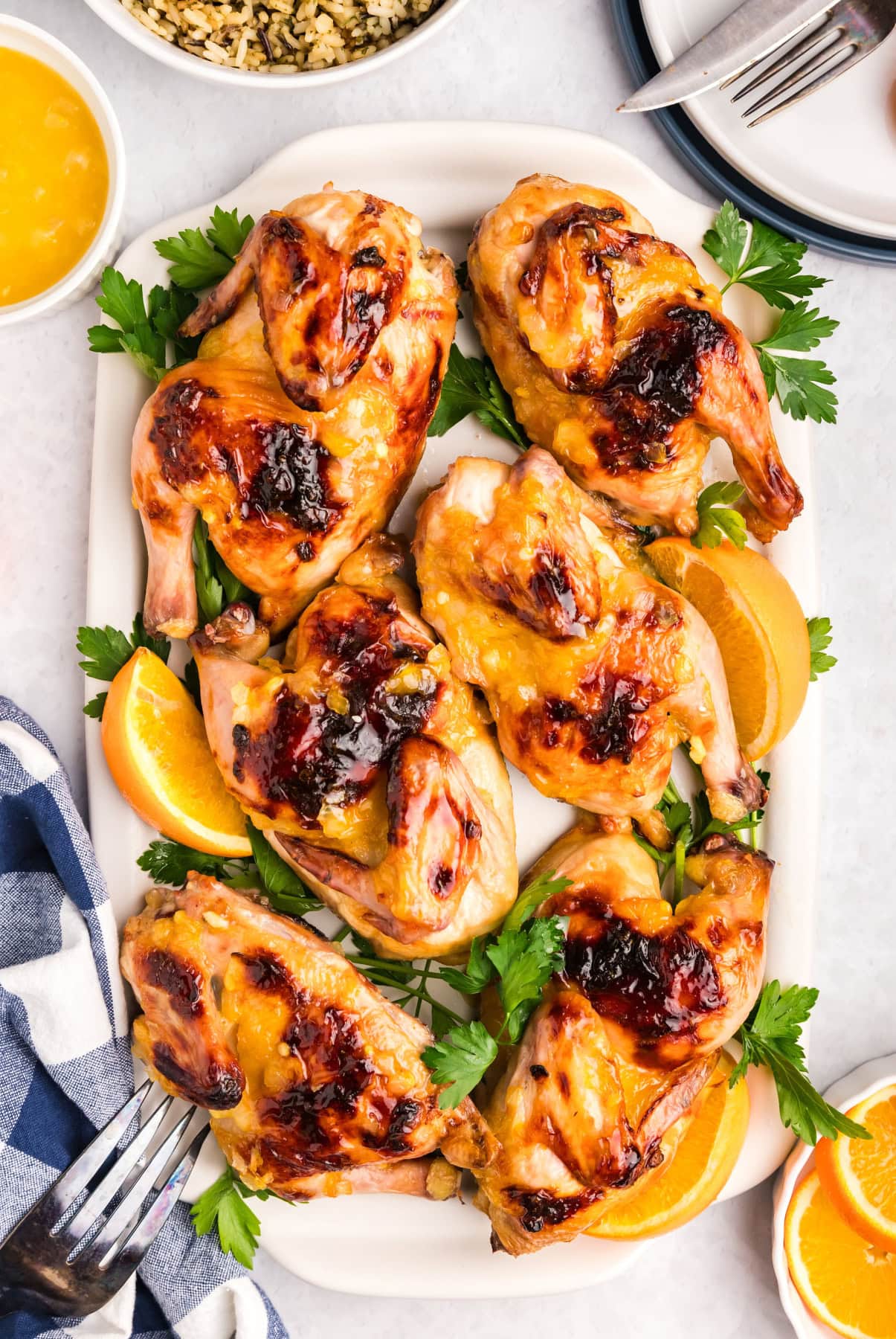 orange glazed cornish hens on a platter