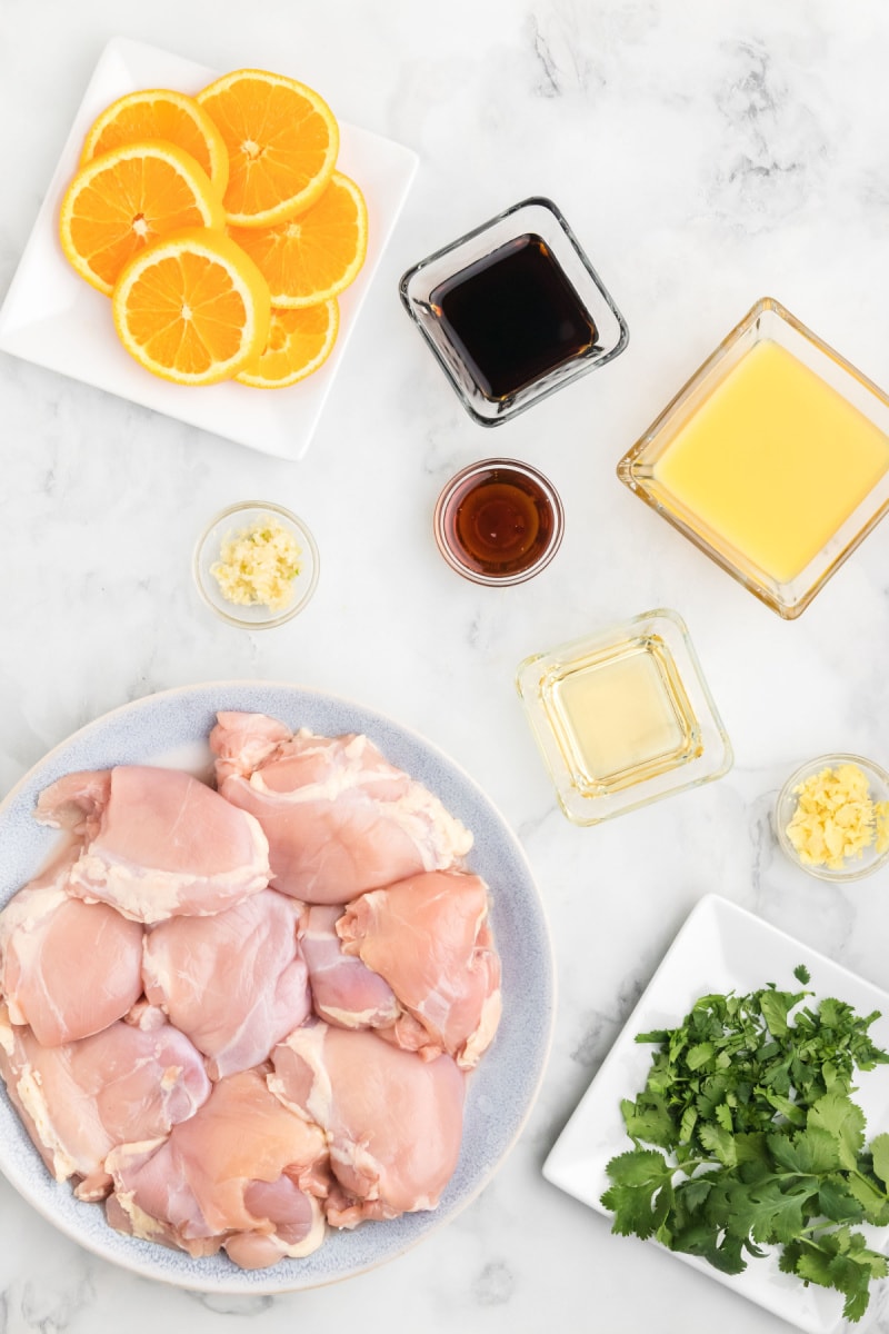 ingredients displayed for making orange and ginger grilled chicken thighs