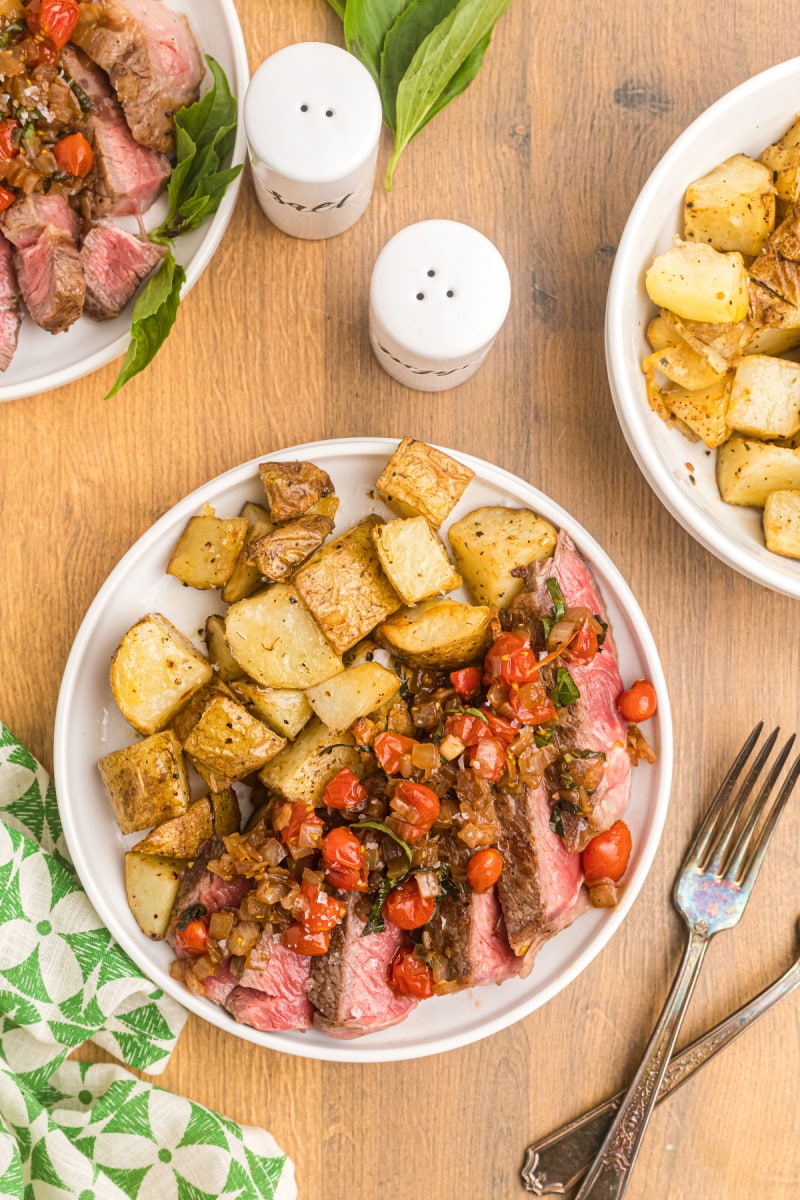 steak and salsa on plate with potatoes