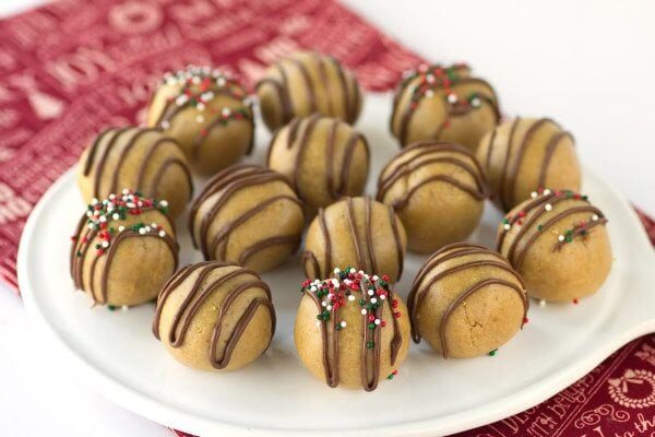 Easy No Bake Peanut Butter Balls drizzled with chocolate - from RecipeGirl.com