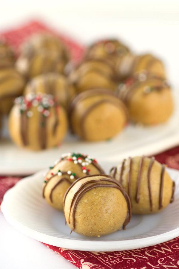 Easy No Bake Peanut Butter Balls drizzled with chocolate - from RecipeGirl.com