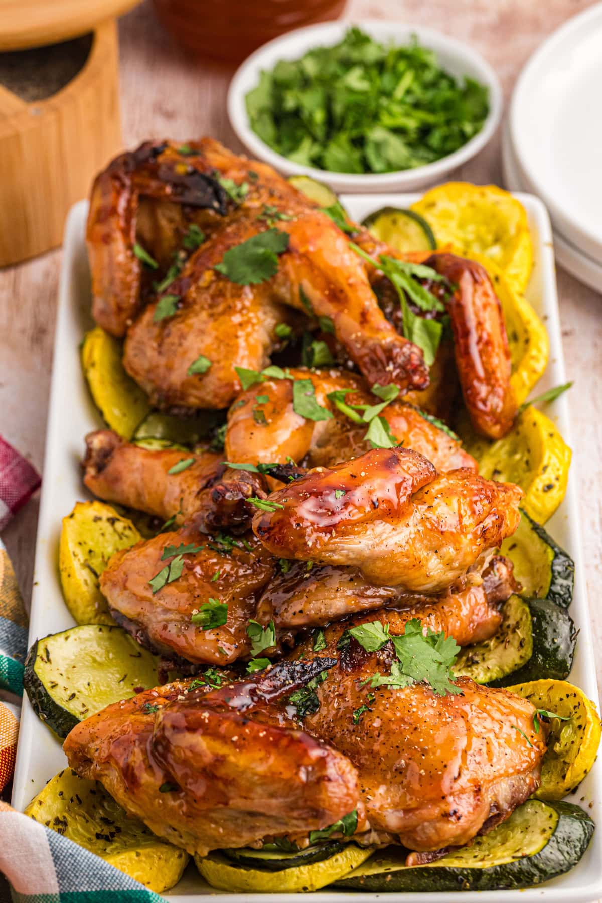 game hens on a platter with vegetables