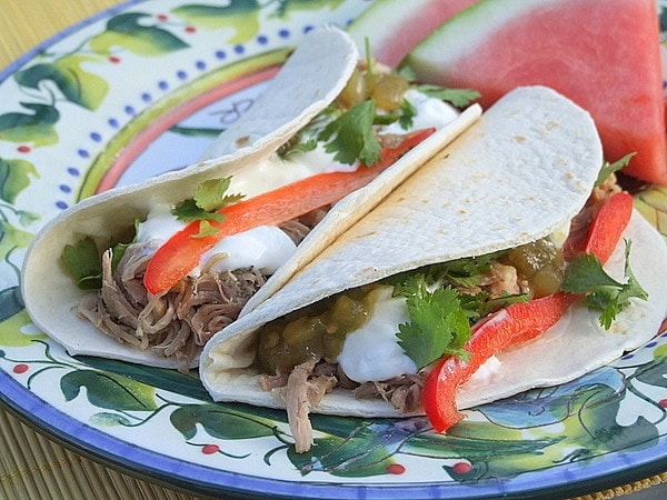 Slow Cooked Carnitas Tacos recipe from RecipeGirl.com #carnitas #tacos Carnitas Tacos on a plate