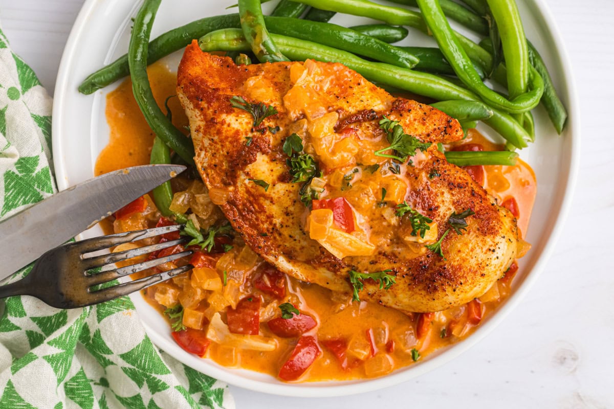 green beans and smothered chicken on plate